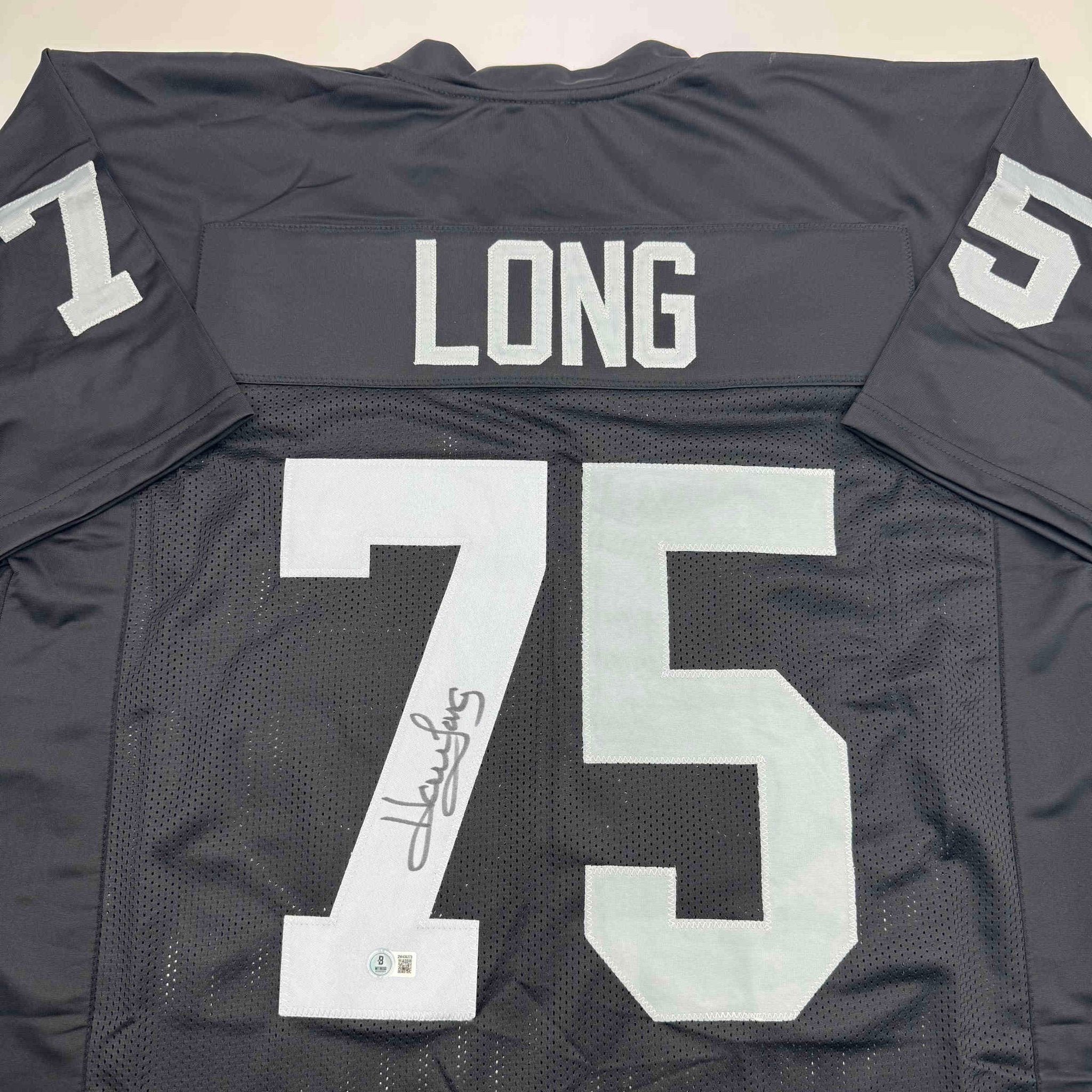 Autographed/Signed Howie Long Oakland White Football Jersey Beckett BAS COA