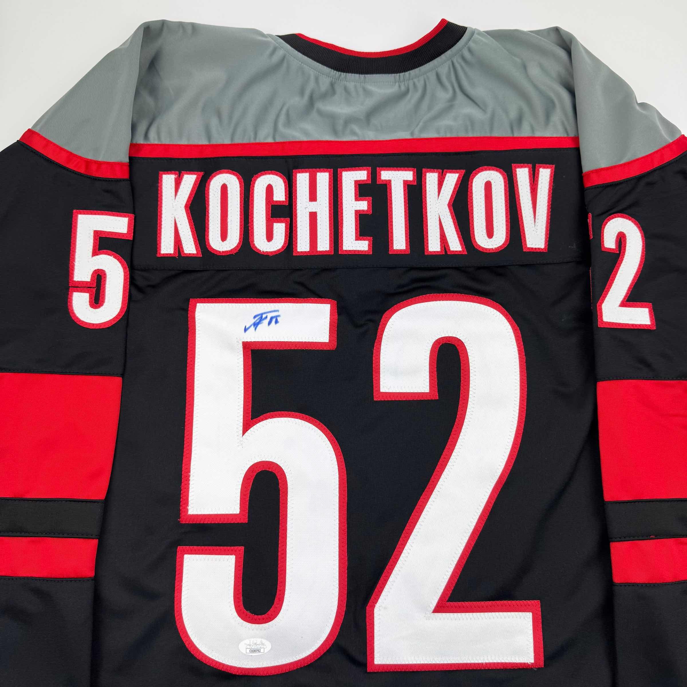 Autographed/Signed Pyotr Kochetkov Carolina Black Hockey Jersey JSA COA
