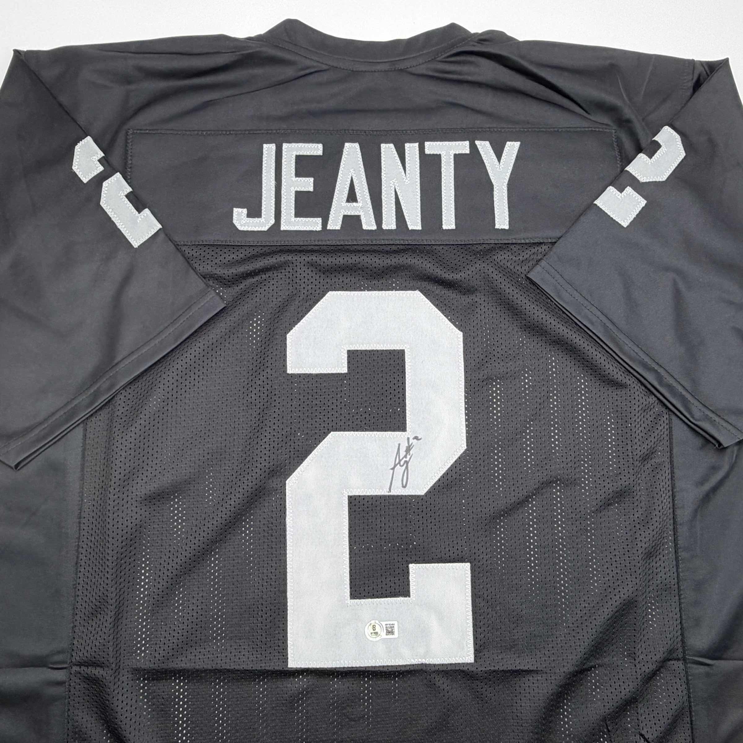 Autographed/Signed Ashton Jeanty Oakland Black Football Jersey Beckett BAS COA