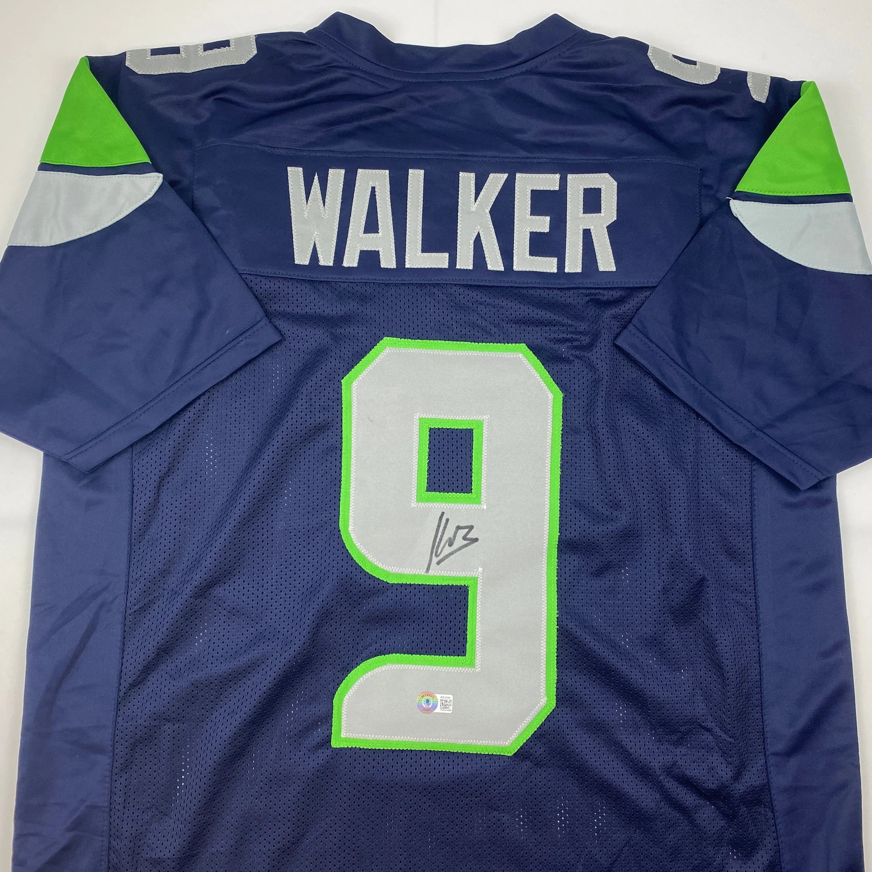 Autographed/Signed Kenneth Walker Seattle Blue Football Jersey Beckett BAS COA