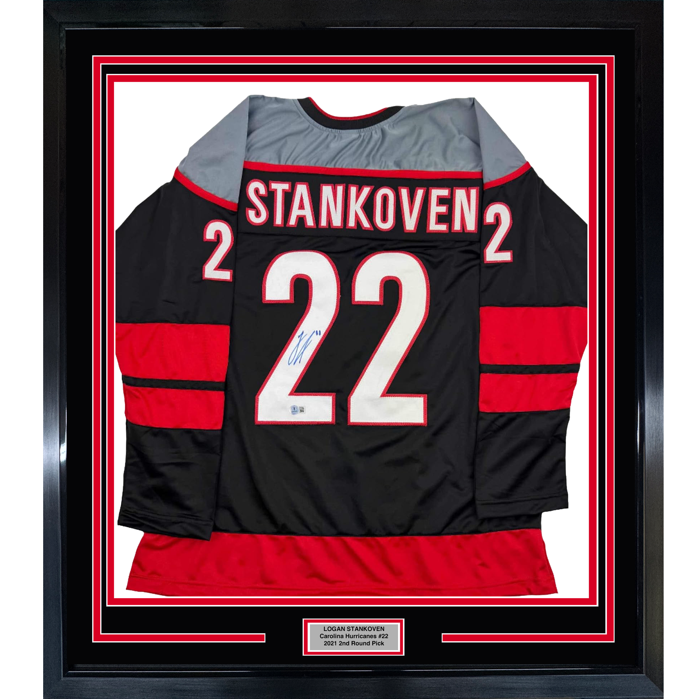 Framed Autographed/Signed Logan Stankoven 35x39 Carolina Black Hockey Jersey Beckett BAS COA