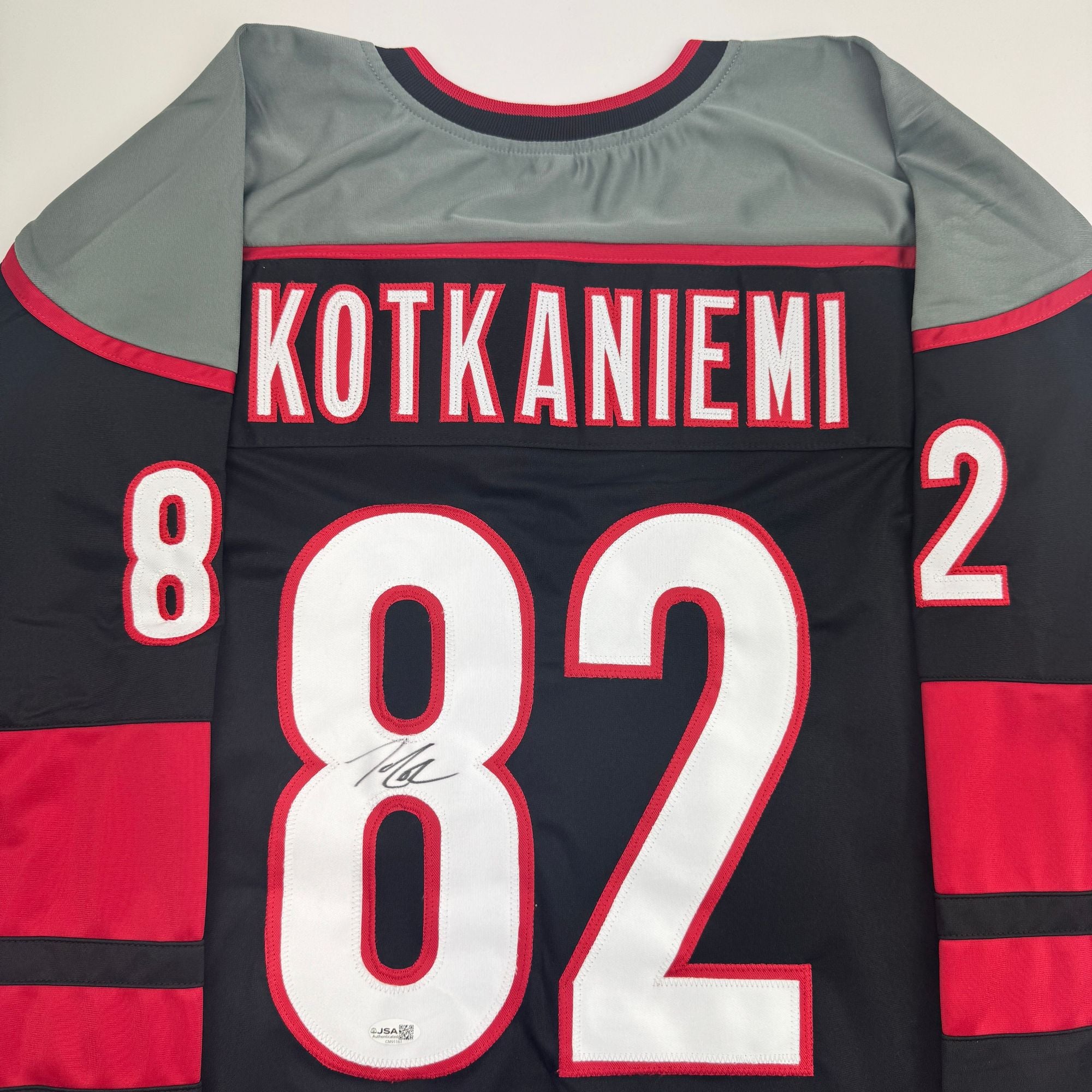 Autographed/Signed Jesperi Kotkaniemi Carolina Black Hockey Jersey Beckett BAS COA