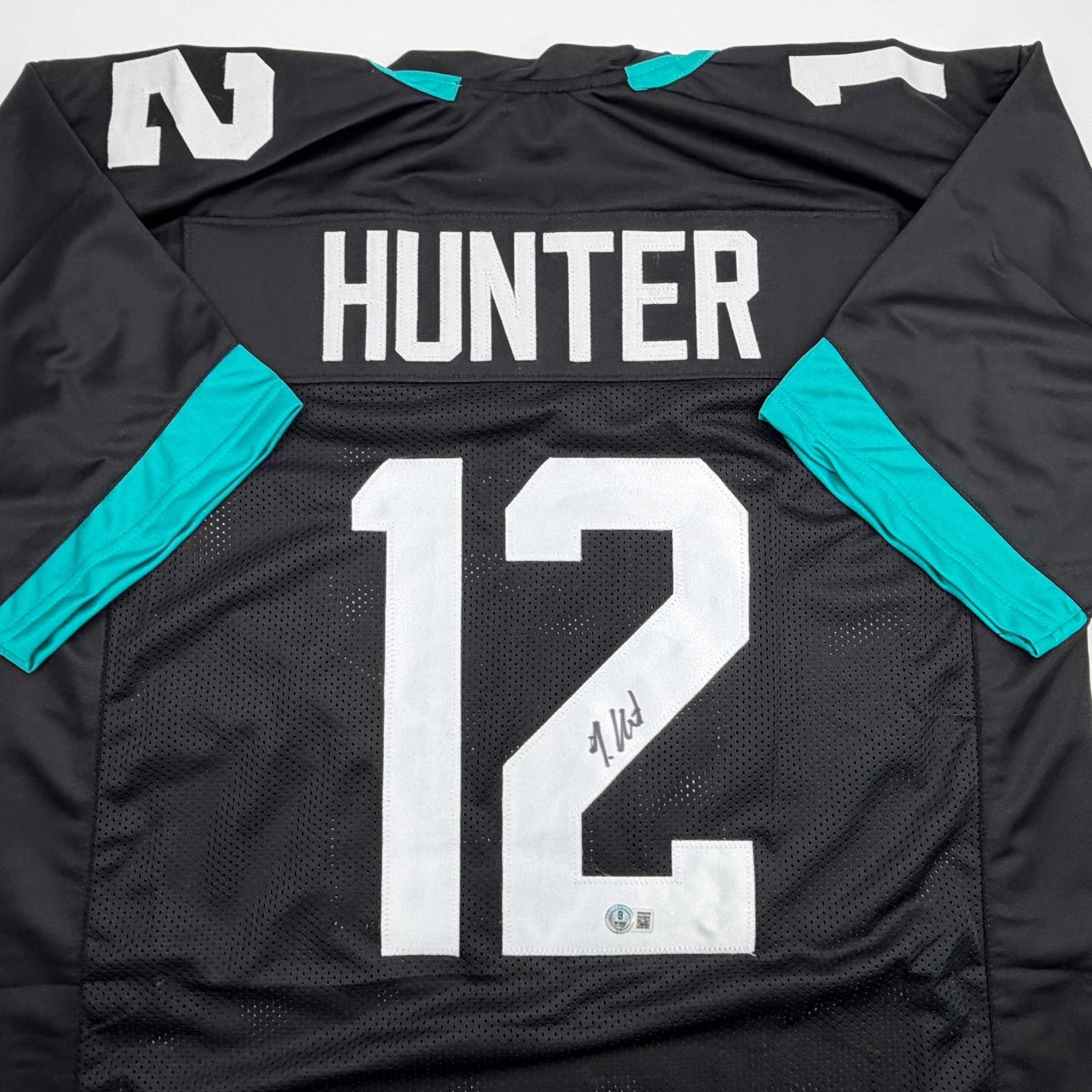 Autographed/Signed Travis Hunter Jacksonville Black Football Jersey Beckett BAS COA