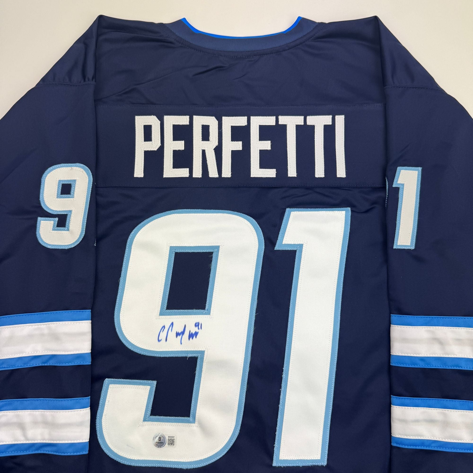 Autographed/Signed Cole Perfetti Winnipeg Blue Hockey Jersey Beckett BAS COA