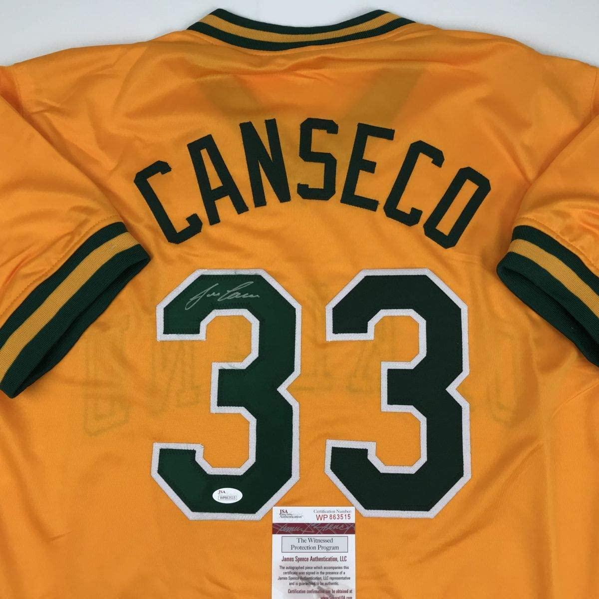 Autographed/Signed Jose Canseco Oakland Yellow Baseball Jersey JSA COA