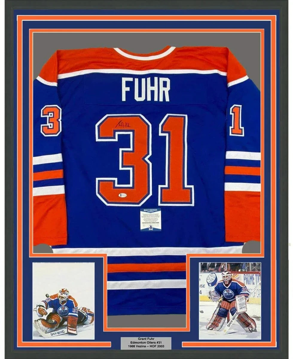 Framed Autographed/Signed Grant Fuhr 35x39 Edmonton Blue Hockey Jersey Beckett BAS COA